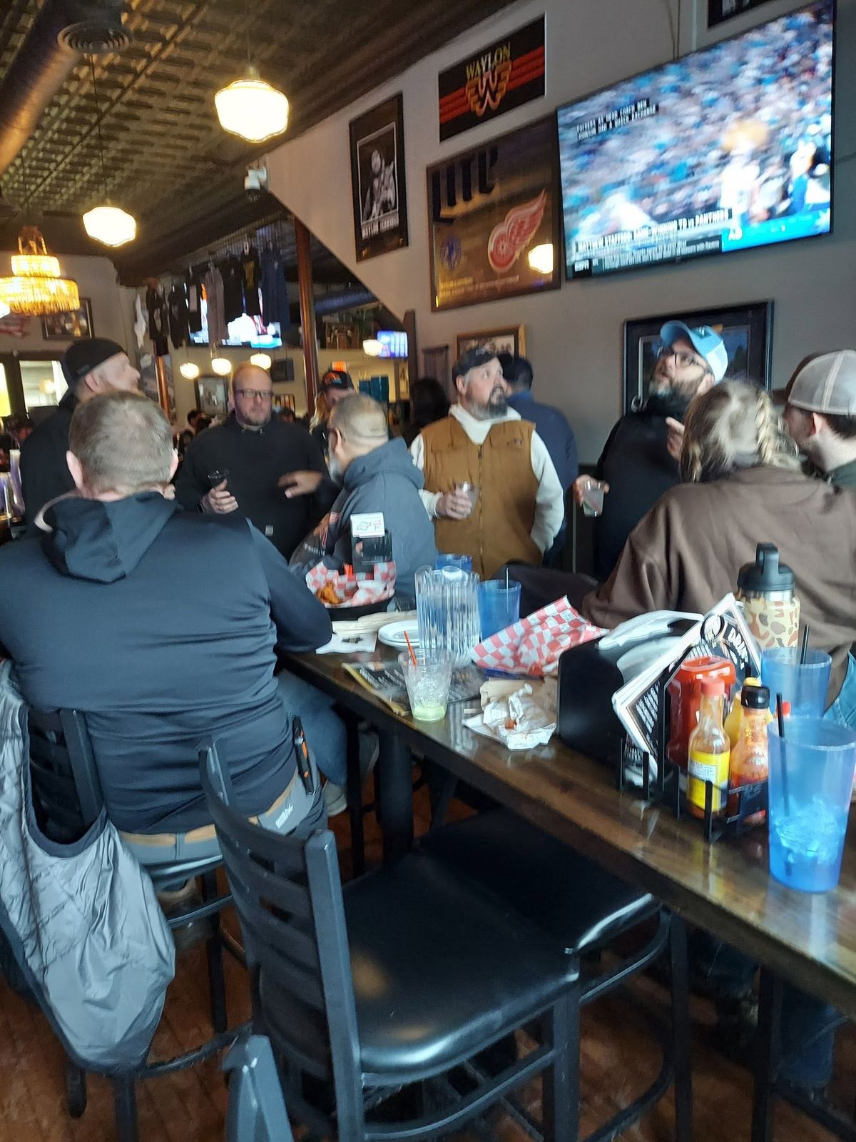Members and guests at the bar during an association social event