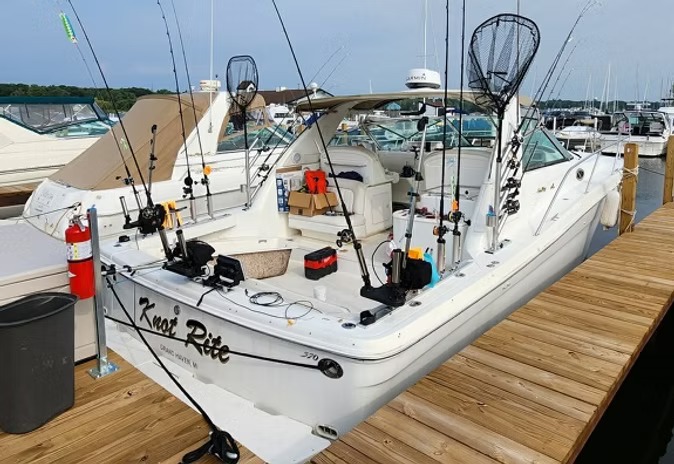 Knot Rite tied up in the marina, rods racked and nets stowed on the transom