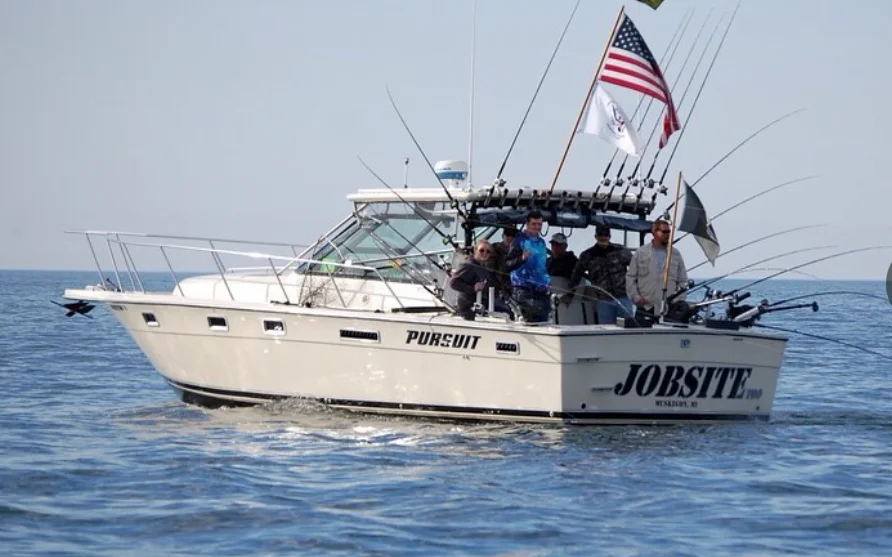 Jobsite Too running with a full crew aboard, rods racked and out, American flag flying